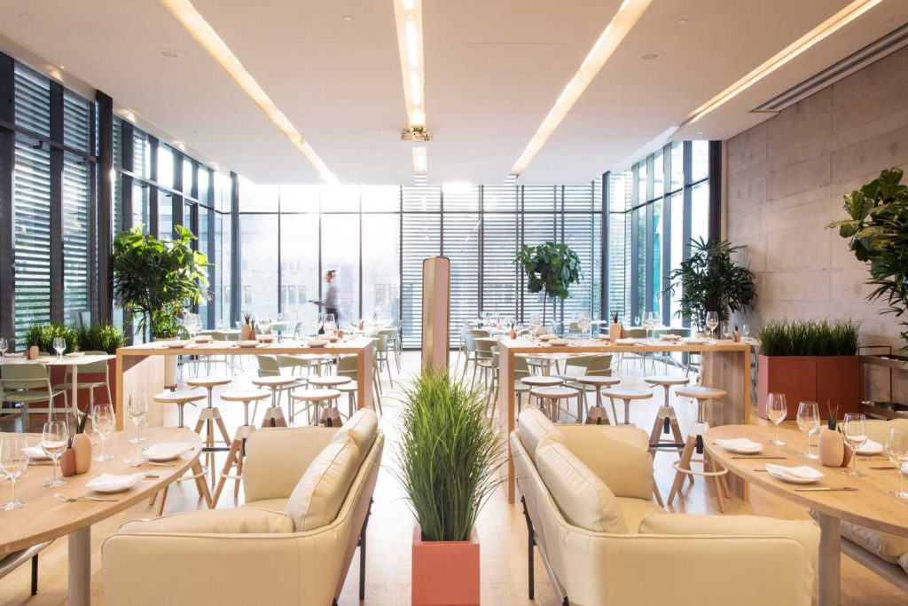 Setup of Clay Restaurant with all seating arranged, high top tables, couches, and tables set up