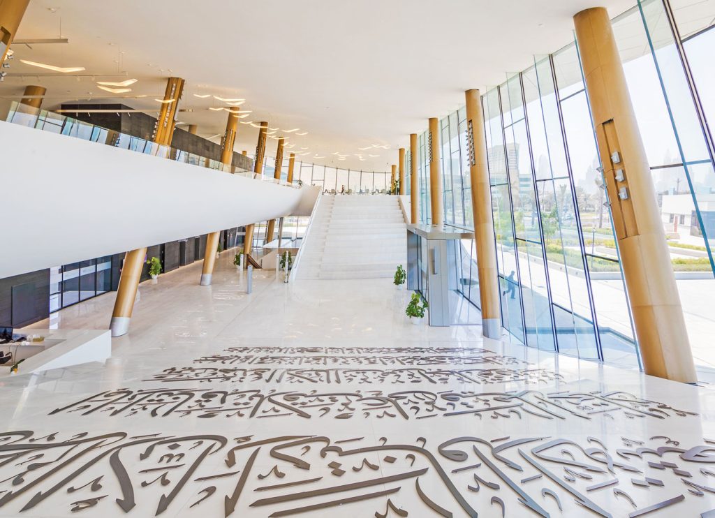Marble covered atrium at Etihad Museum, with marble steps.