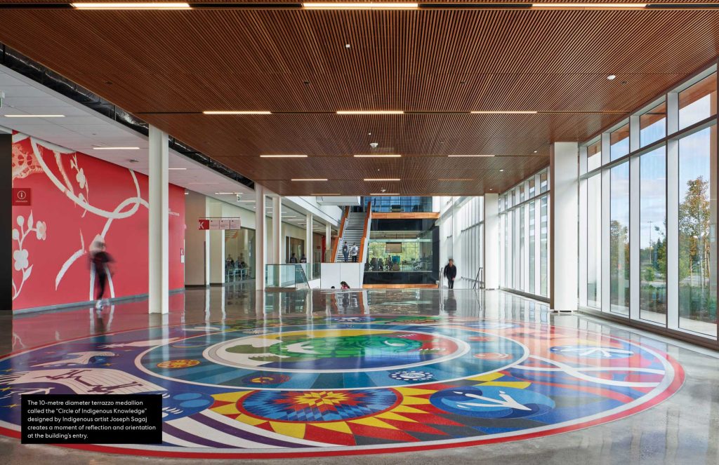 A 10 meter terazzo medallion called "Circle of Indigenous Knowledge" designed by Indigenous artist Joseph Sagaj creates a moment of reflection and orientation at the building's entry.