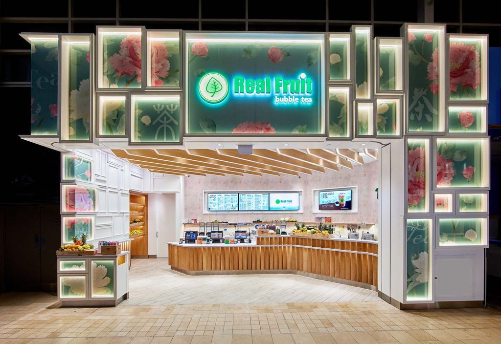 Colorful storefront design with individually lit geometric boxes showcasing Asian inspired graphics make this store stand out.