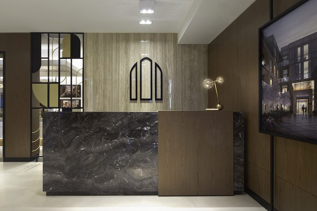 Welcoming reception desk area, modern clean lines of the marble and wood front desk