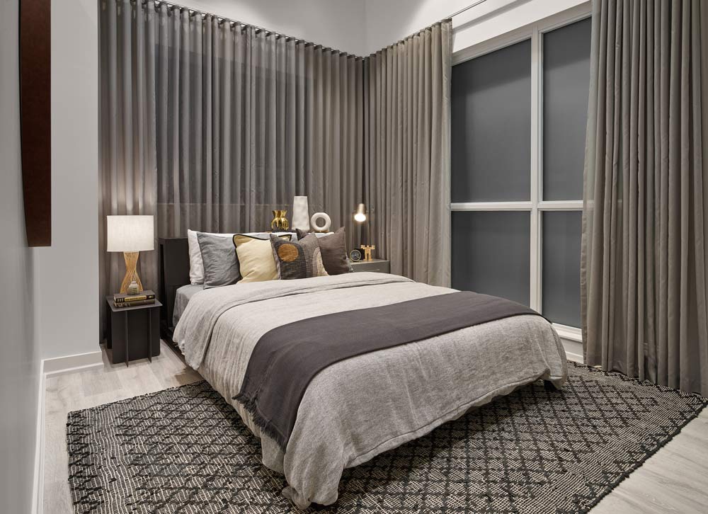 Luxurious model bedroom in taupe and beige tones