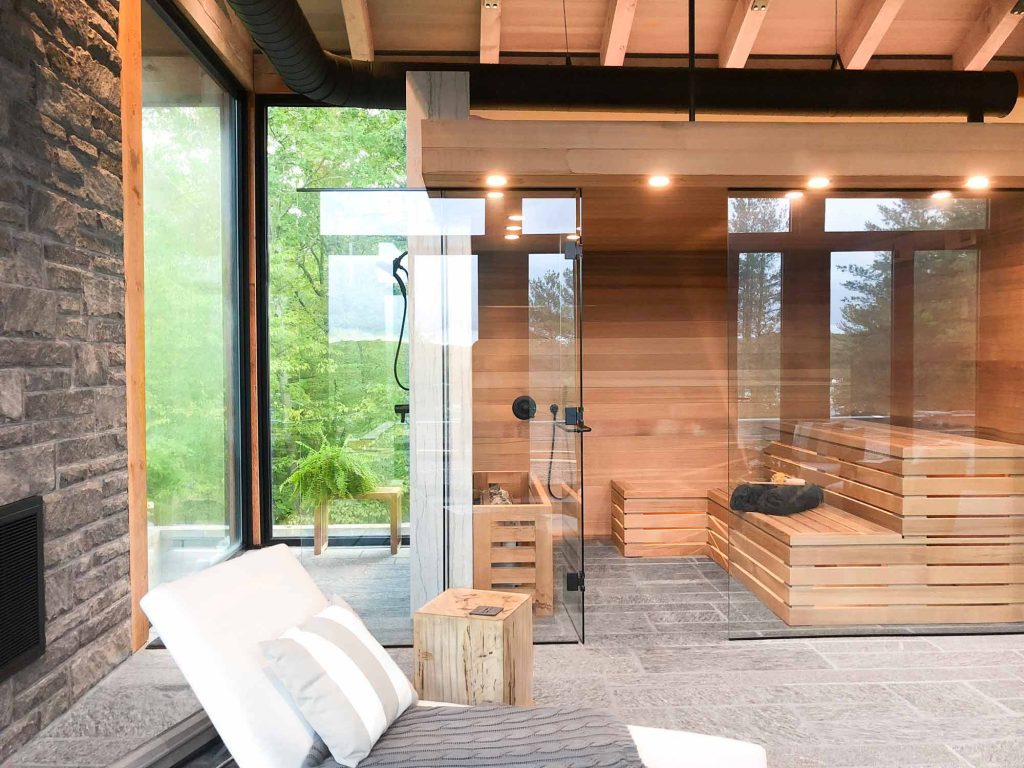 custom glass walled sauna and shower that allow views to the outside