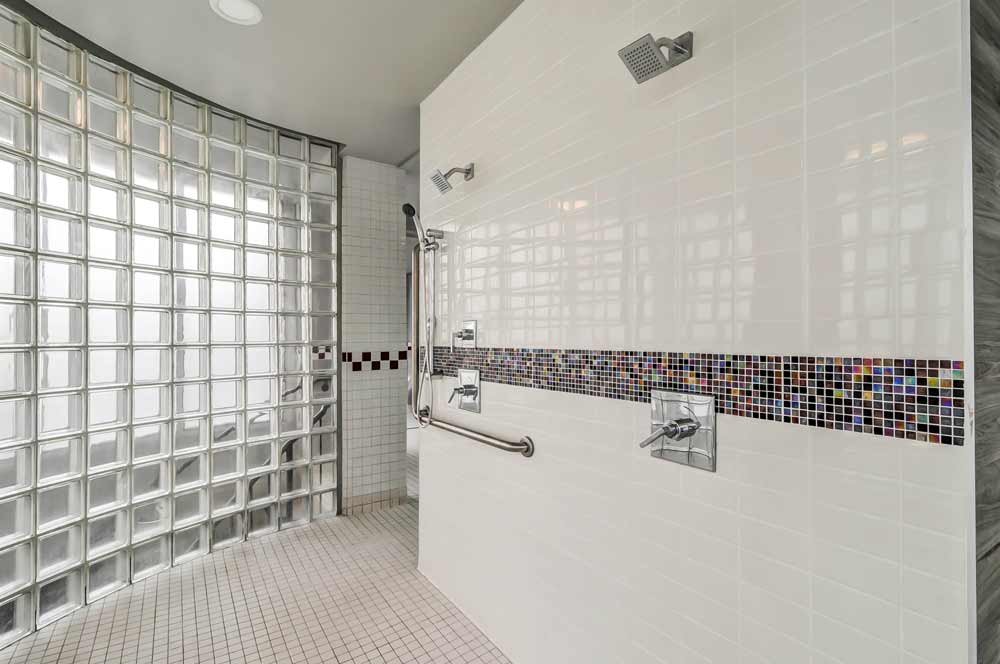 Barrier free pool deck shower with new fixtures and grab bars