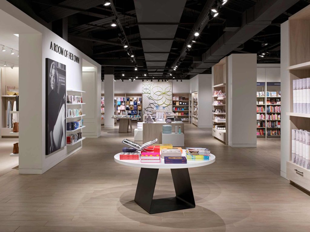 A feminine area of the store "A room of her own" with modern round display tables and display units