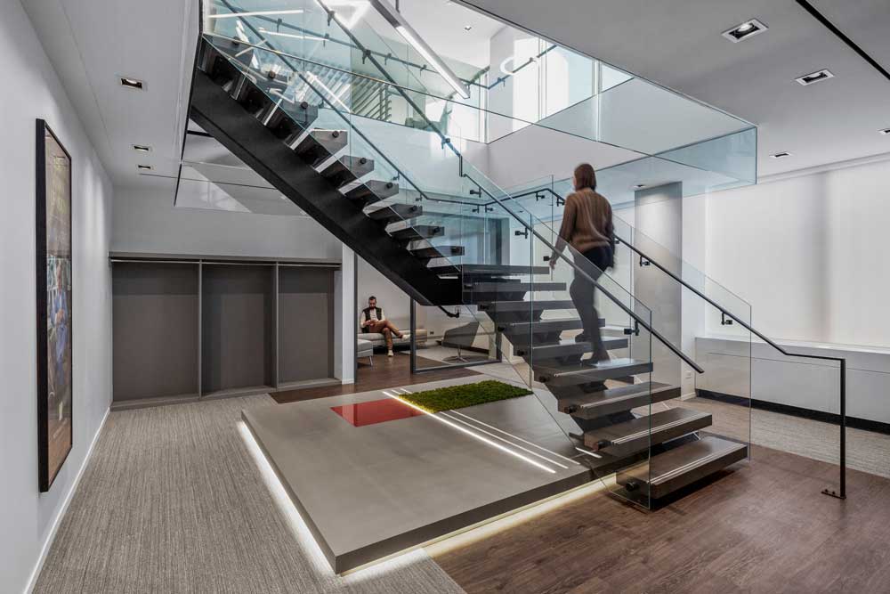 The staircase leading from the lower level to second floor