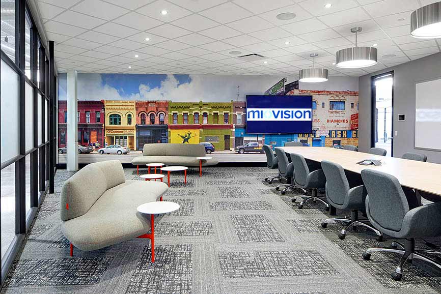 Large meeting room for larger meetings, with a colorful street mural on the wall