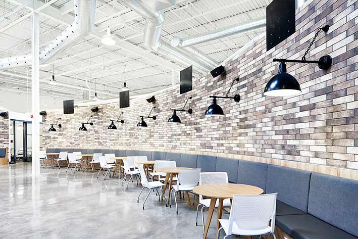 Rounded brick wall with long bench seating along the entire length of the wall