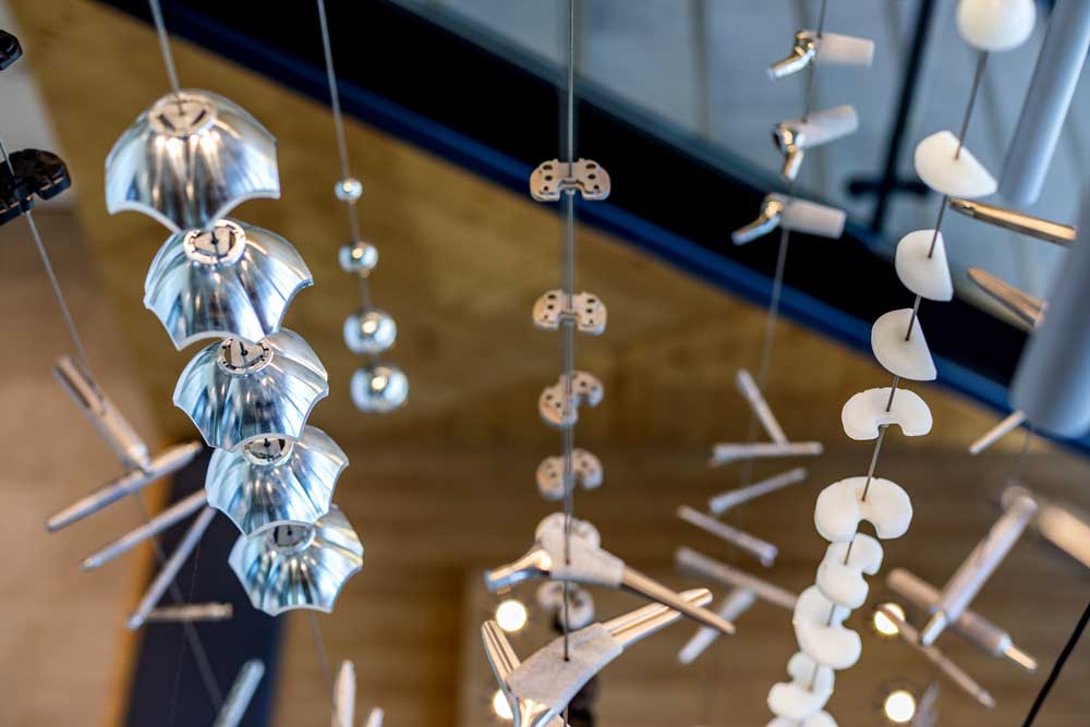 Closeup of the small light reflecting metal pieces of the chandelier