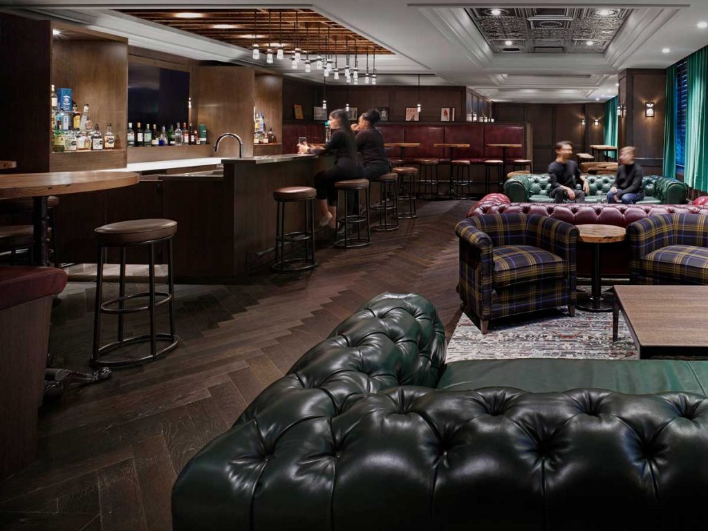 A warm and inviting speakeasy bar and lounge area