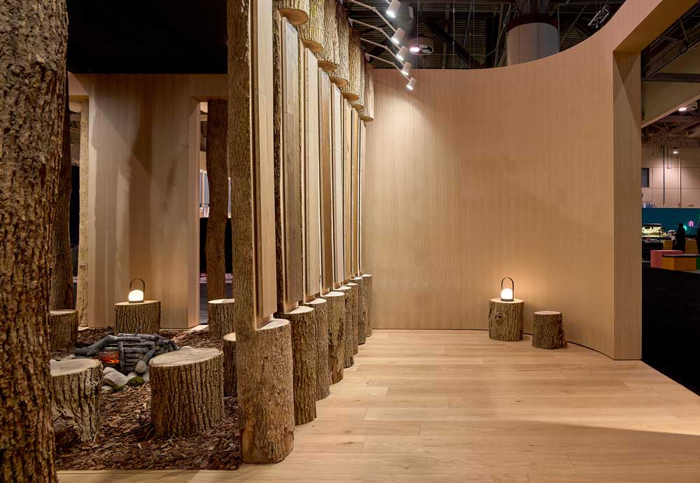 a wall of raw wood logs with integrated product offerings