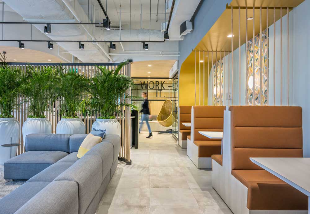 Boots seating on the right of the passage and couch on the left