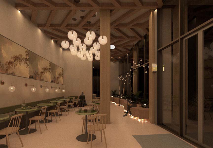 Michelle Booy's restaurant area with floor to ceiling windows at night with lights on