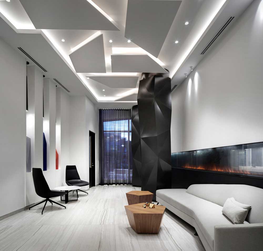 Geometric origami-like black columns, and ceiling details in the lounge area of the lobby