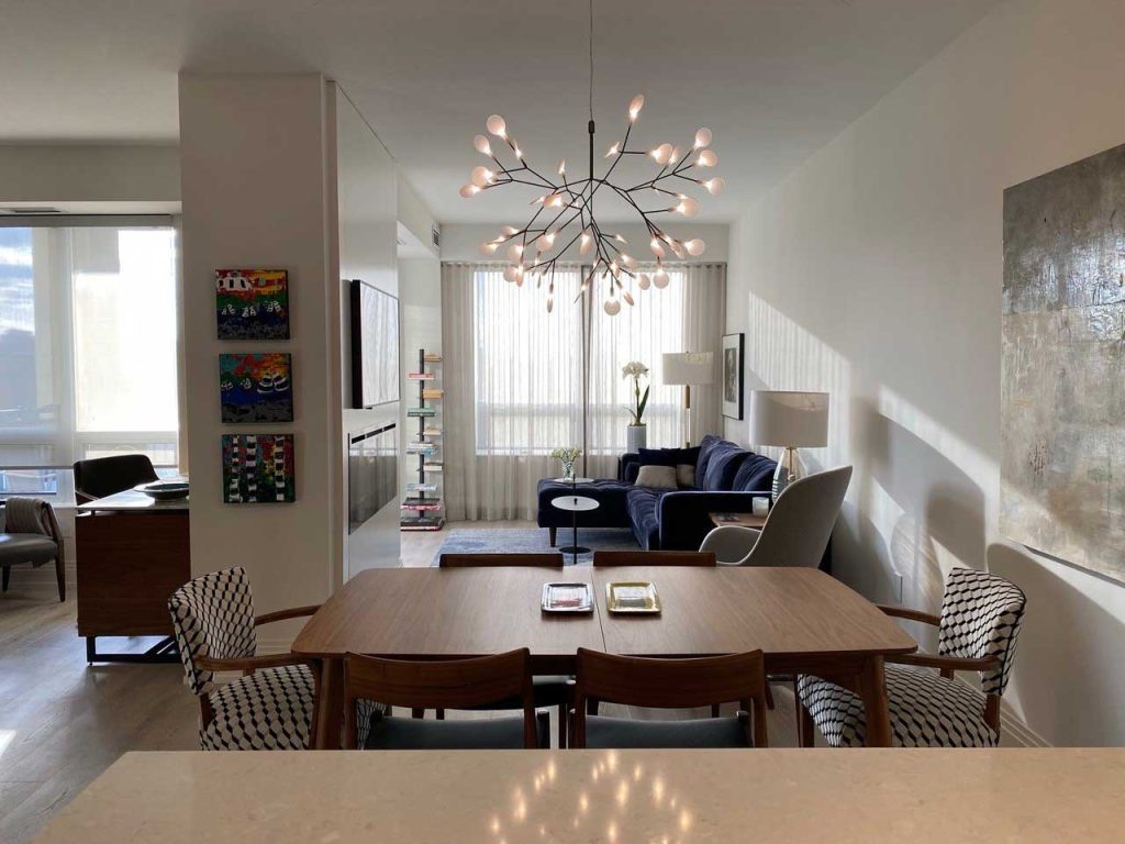 A view of the dining, living and den areas as seen from the kitchen