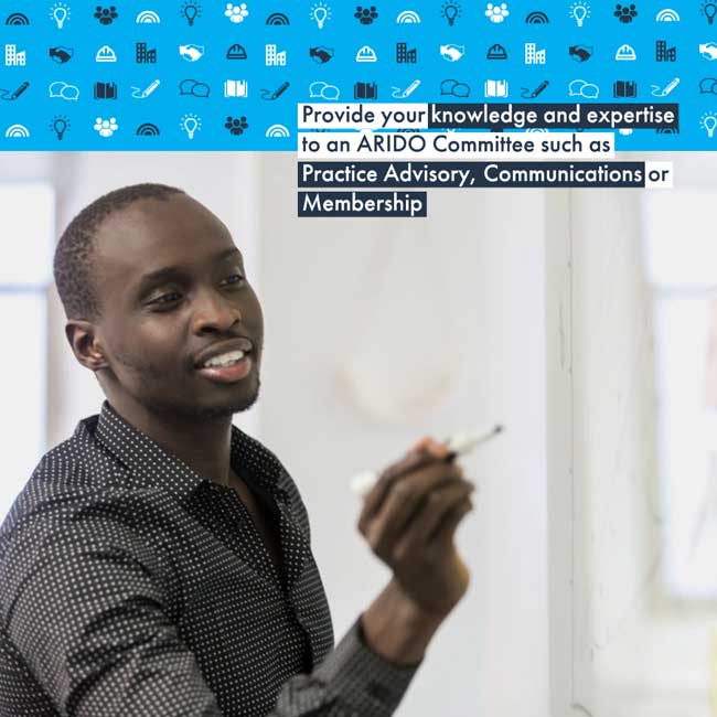 A smiling Black man writes on a whiteboard in a meeting with the caption, "Provide your knowledge and expertise to an ARIDO Committee such as Practice Advisory, Communications or Membership."
