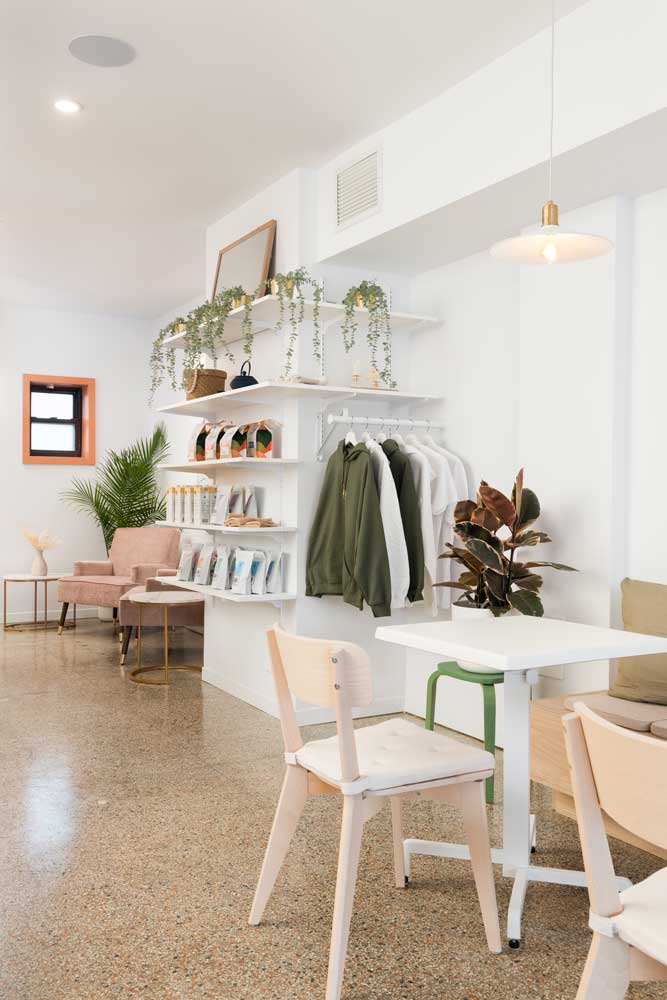 A wall of merchandise including coffee beans and some clothing items