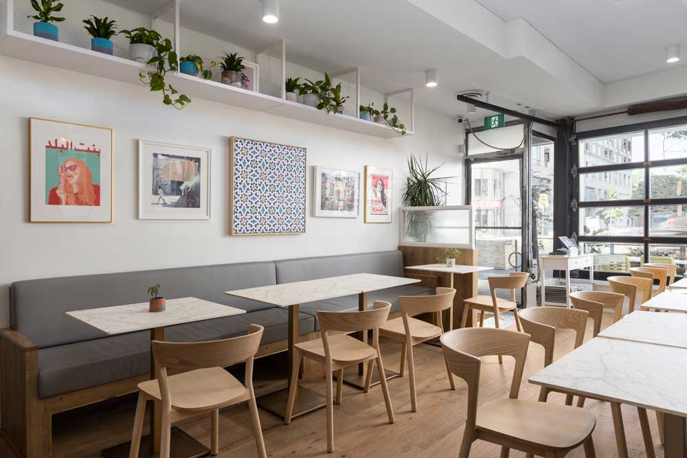 Original Artwork with Lebanese motifs decorate the plain white walls throughout