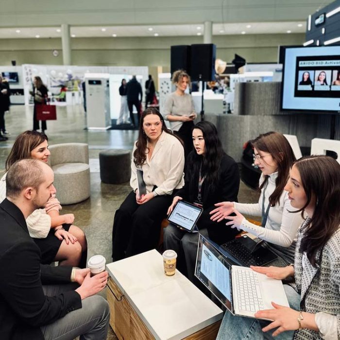 Jeremy-and-Emaa-with-students-edited