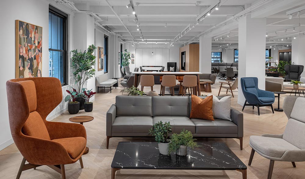 several lounge spaces and collaborative work spaces are visible, featuring Keilhauer furniture, in many different tones and colours, and materials